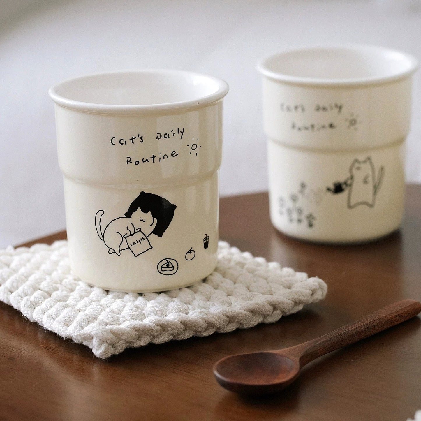 Sweet and whimsical ceramic cup ideal for warm interiors. This handcrafted ceramic mug features meditating cats and fits effortlessly into aesthetic home styling.