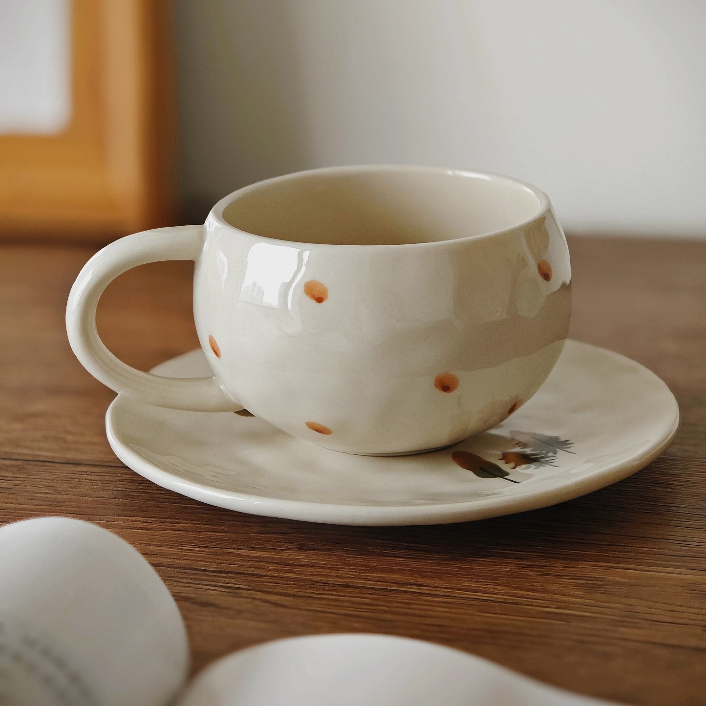 Charming illustrated ceramic cup set with retro-inspired forest drawings in warm tones. This handcrafted pottery cup with saucer is designed for those who love kawaii ceramic cups, forestcore aesthetics, and animated, cheerful everyday mugs with a hint of childhood nostalgia.