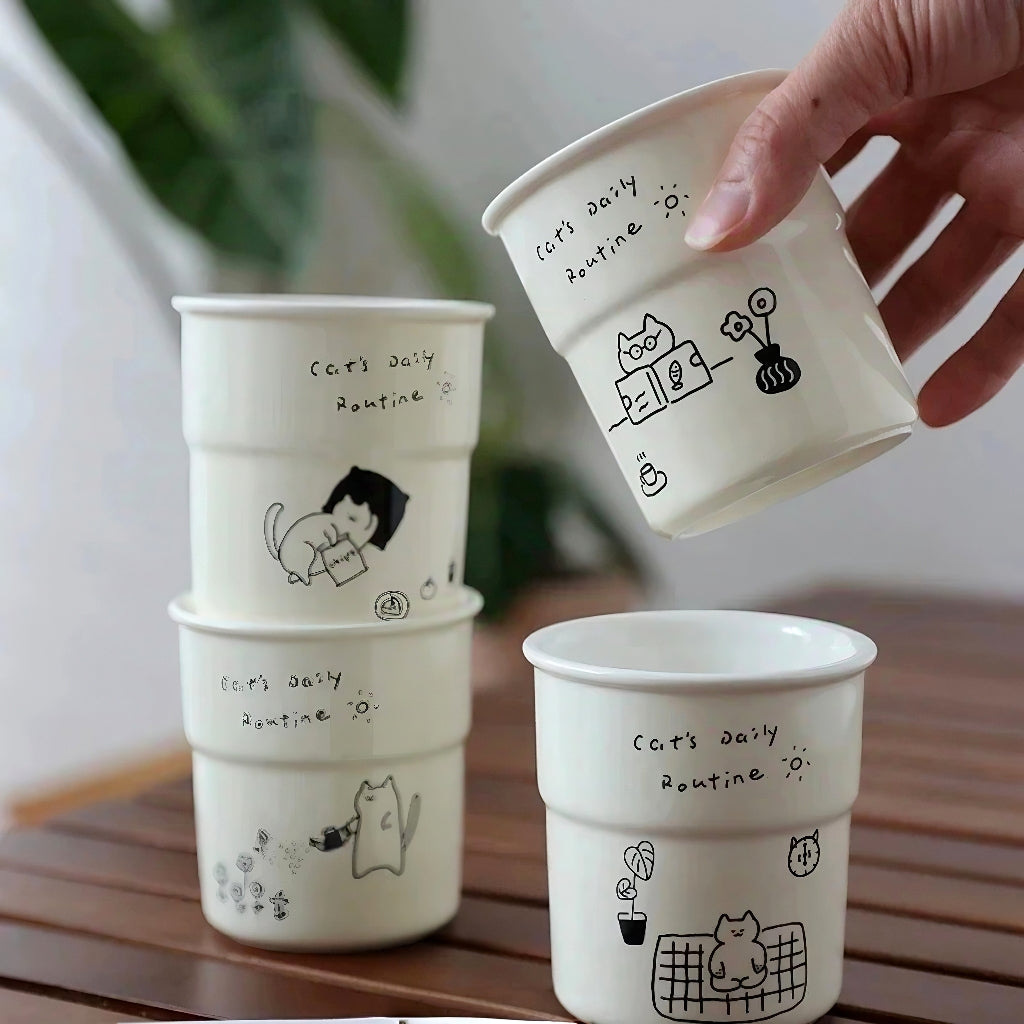 Kawaii ceramic cup with playful illustrations of kitten’s daily life, perfect as a heartwarming coffee mug and cute gift for bestie or mom.