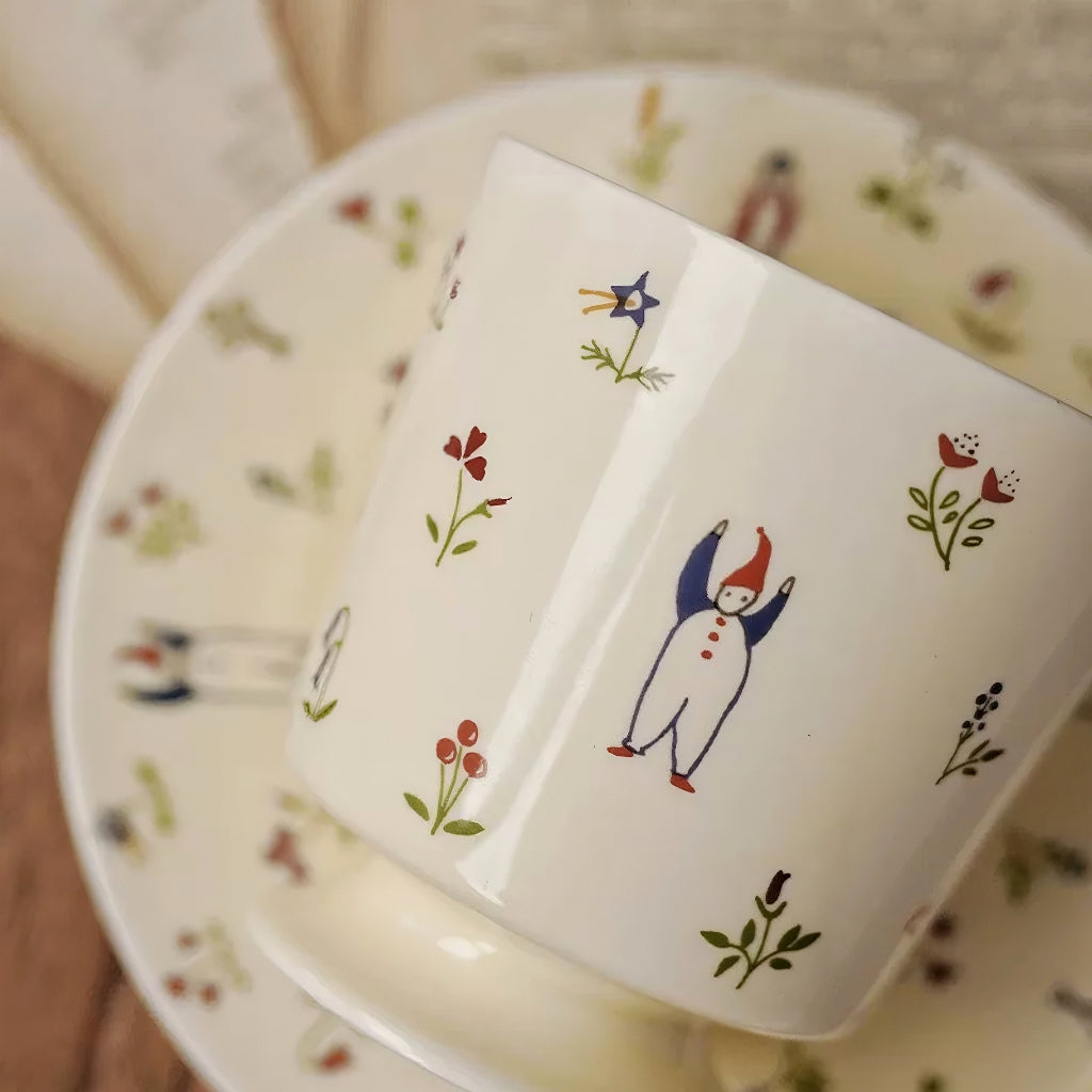 Aesthetic drinkware featuring hand-painted snowman in a botanical winter scene. Adorable, durable, artistic.