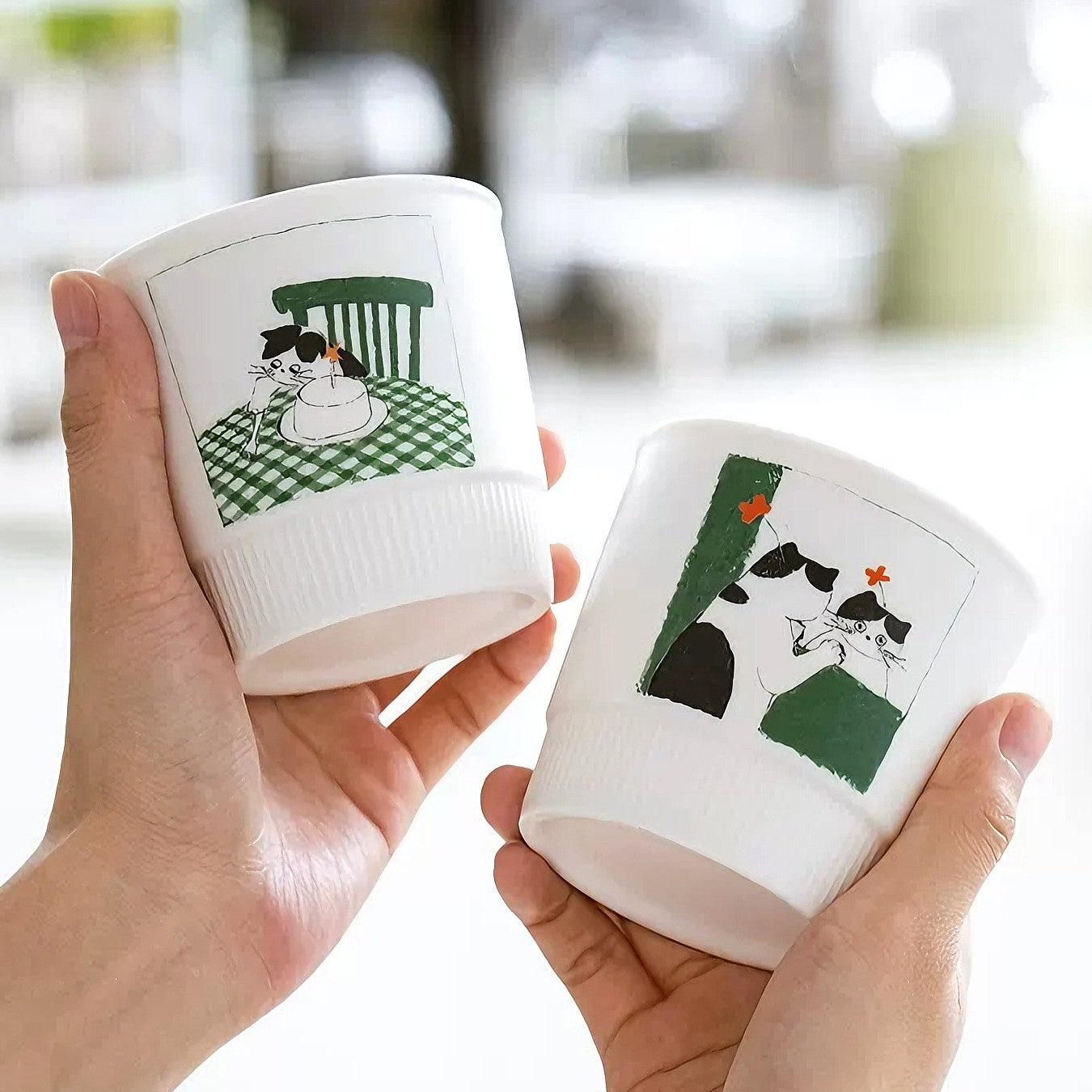 Artistic painted mug with a kitten enjoying a cake slice. Playful kids-style mug in soft green with a delightful doodle of a curious kitten. This charming illustrated mug makes coffee moments joyful and is a durable stoneware cup for hot drinks or decorative display.