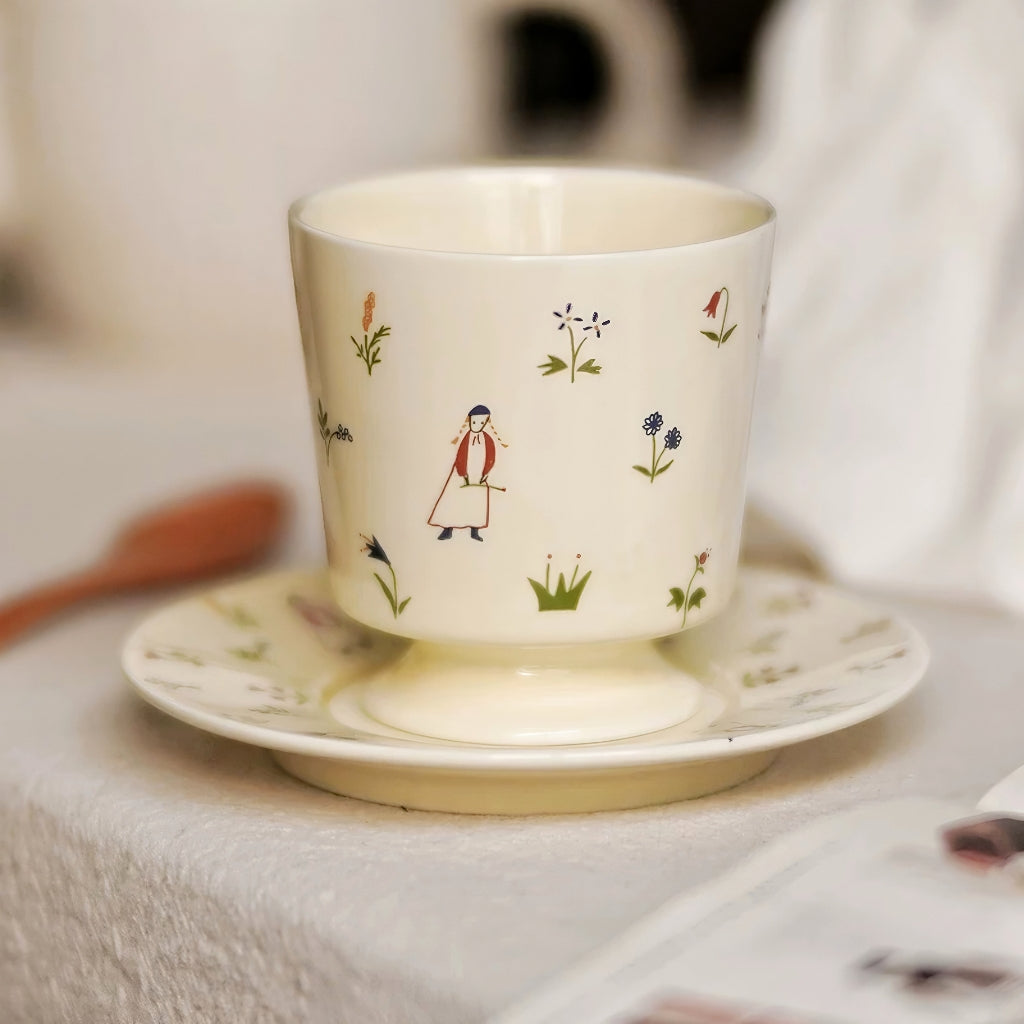 Artistic ceramic mug with snowman and floral illustration, perfect for cozy home essentials. Cute and lovely gift for girls and bestie.