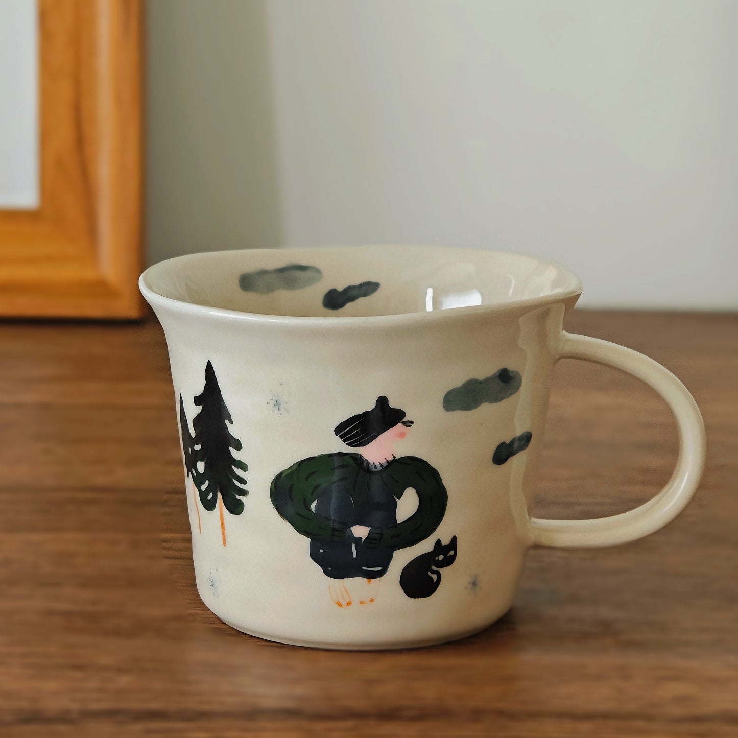 Delightful ceramic mug designed with joyful sketch art, capturing a forest walk moment. Featuring soft Nordic tones and a sweet, animated style, this hand-pinched style cup is a cozy and cute drinkware choice for daily tea rituals.