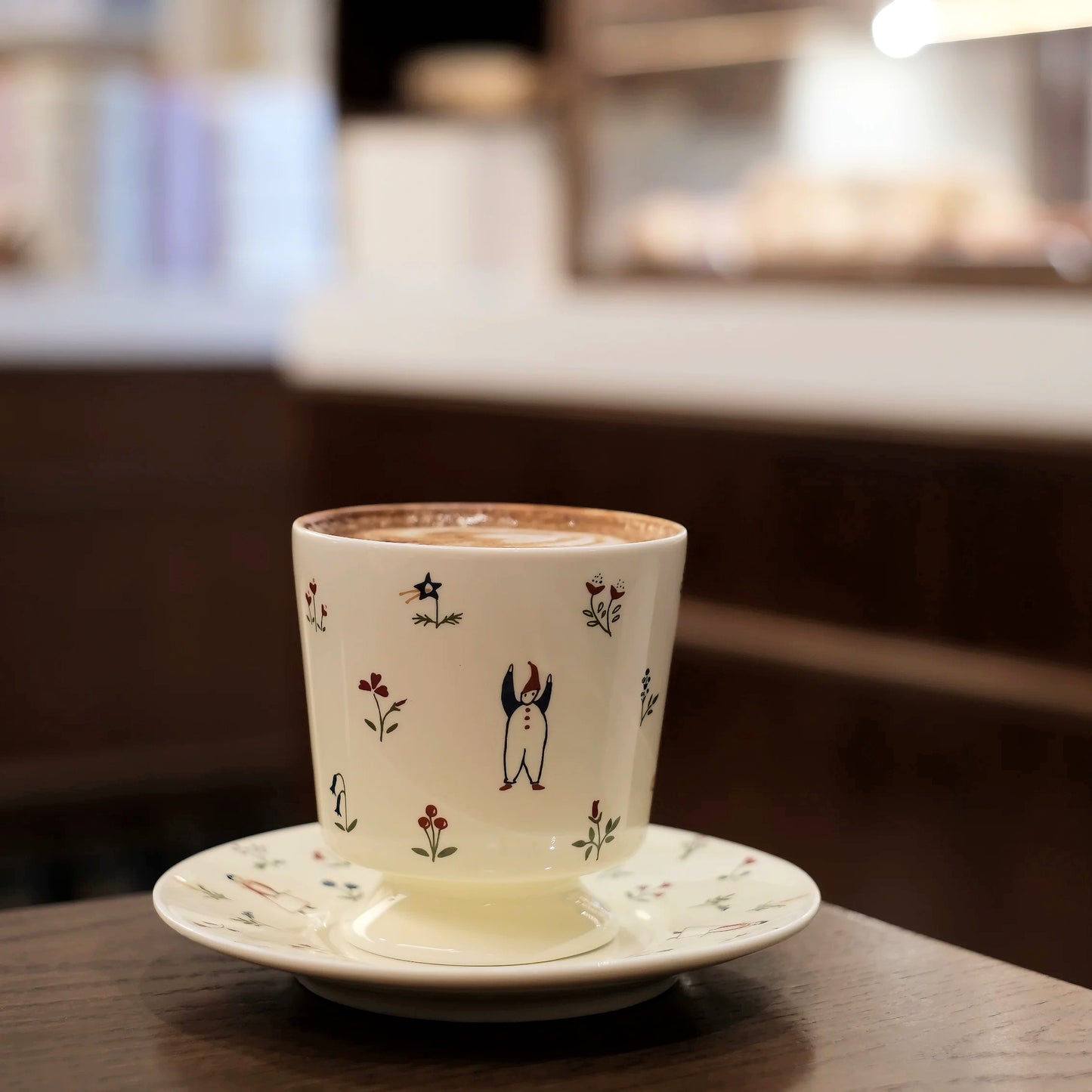 Delightful and playful kids-style ceramic coffee cup with cheerful secret garden motifs. Aesthetic drinkware, giftable.