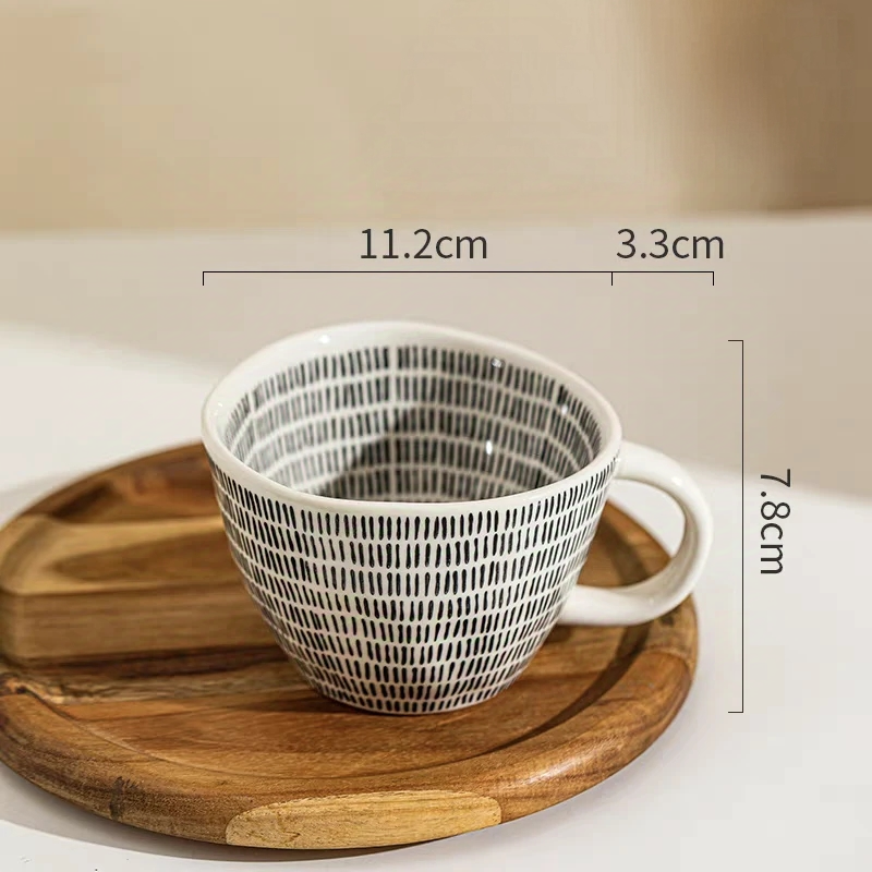 Durable mug featuring bold black dots and a 350ml capacity.Hand-painted, Nordic style.