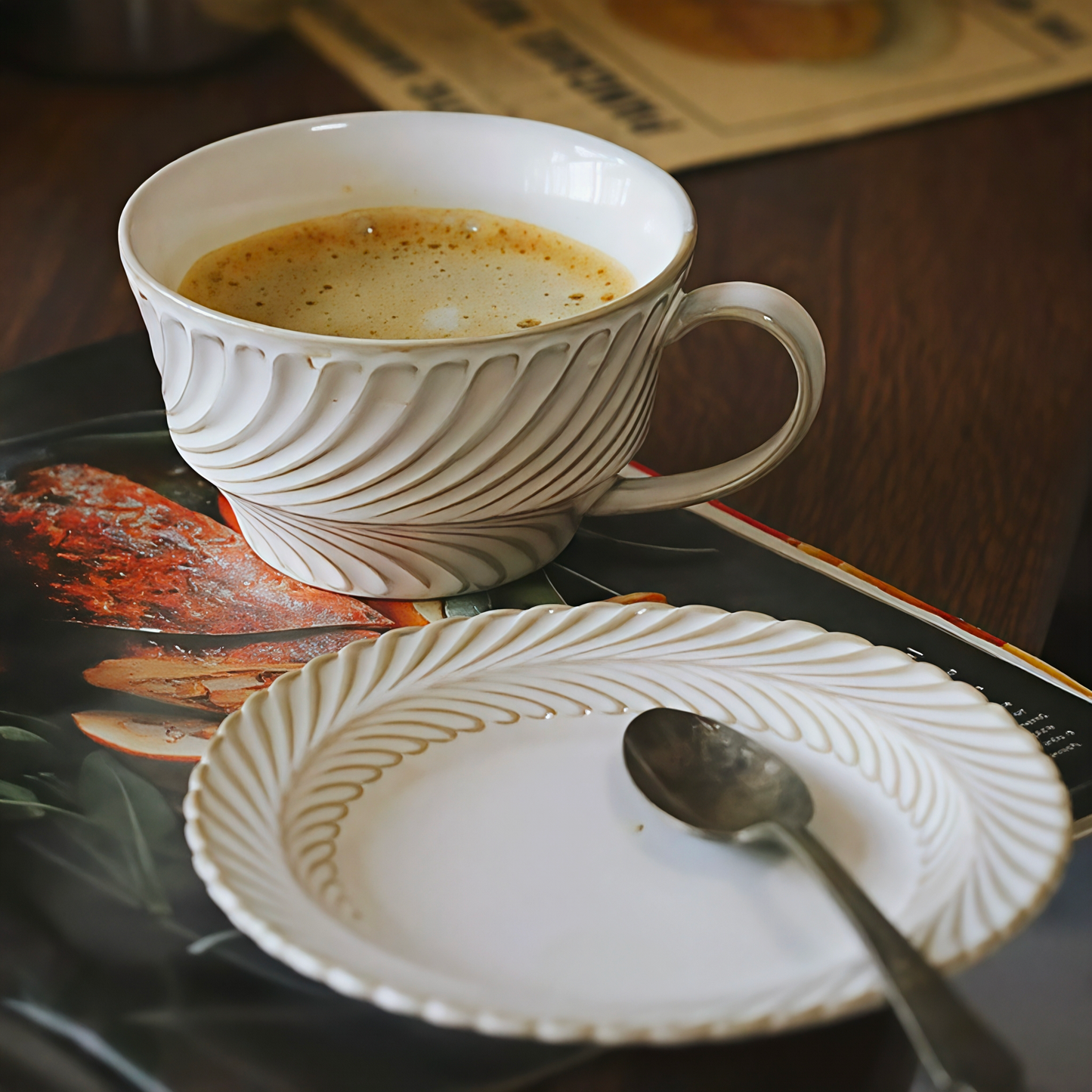 Artisan-style minimalist ceramic cup in soft ivory white, inspired by classic European tea set design. Perfect for tea, coffee, iced or hot drink.