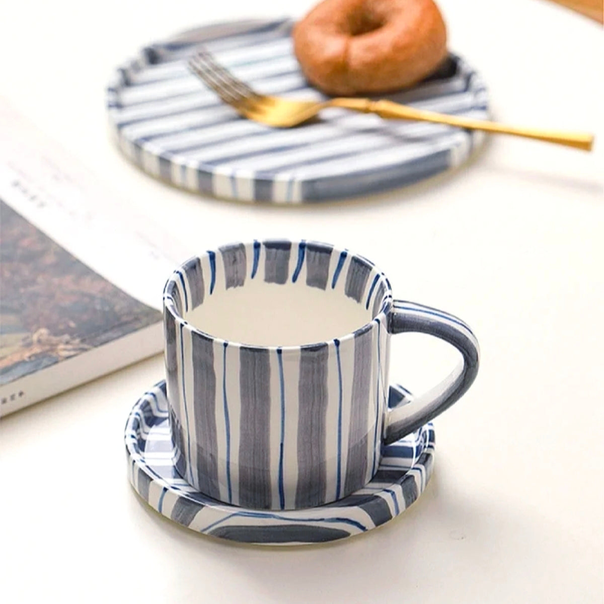 Versatile ceramic cup and plate set in cerulean blue, perfect for coffee, tea, and desserts, blending style and practicality for daily use.