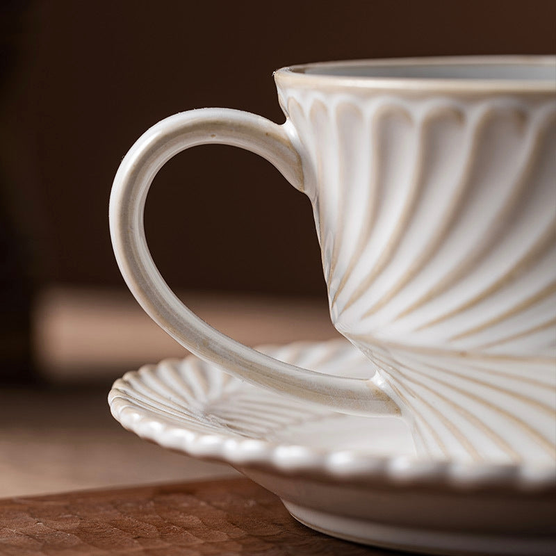 Soft-toned, aesthetic coffee mug with rustic porcelain-inspired detail, blending Japandi and Nordic decor styles.