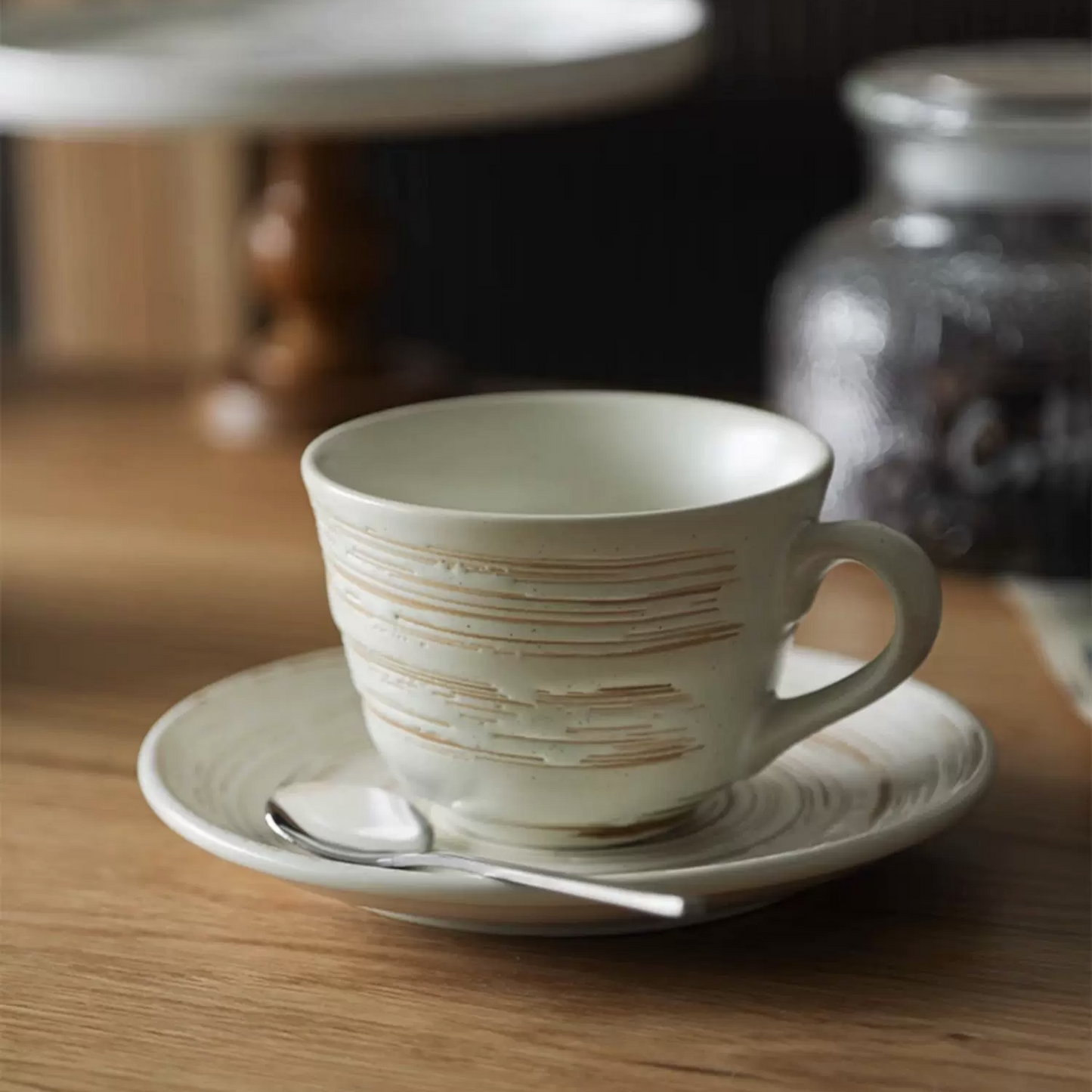 Rustic, minimalist mug and saucer set with hand-carved texture. The earthy design and matte glaze make it the perfect addition to your Scandinavian-inspired home or a gift for tea and coffee lovers.