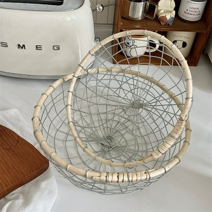 Full view of the round woven metal wire storage basket, emphasizing its decorative design and generous dimensions for stylish and practical home storage. Two sizes available.