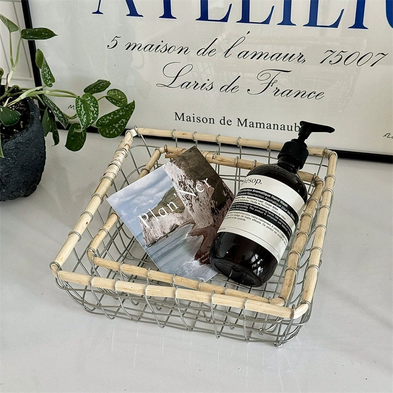 Square woven metal and rattan basket with kitchen and living room essentials, perfect for adding a touch of Scandinavian decoration to your dining room.