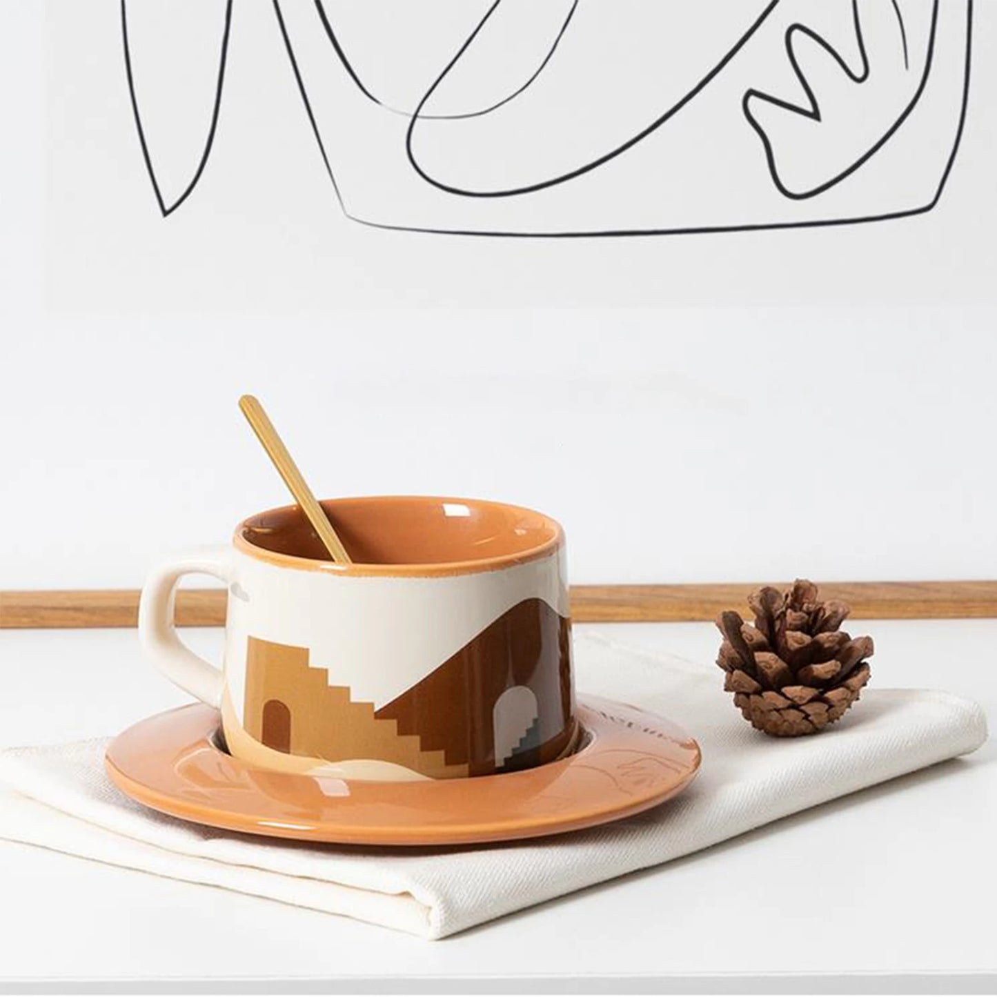 Ceramic coffee cup featuring oasis prints and matching plate, crafted with durable ceramic for hot beverages in Scandinavian-style homes.