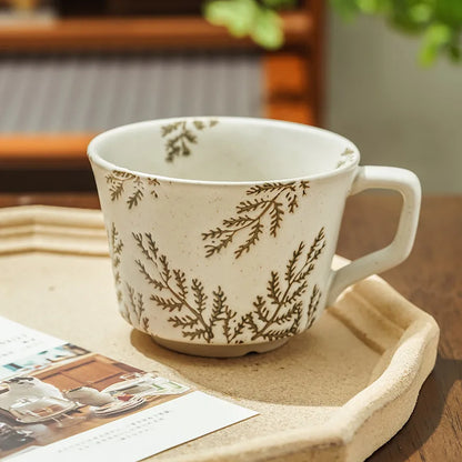 Textured ceramic mug with a graceful willow design, blending retro and Japandi styles in a neutral color.