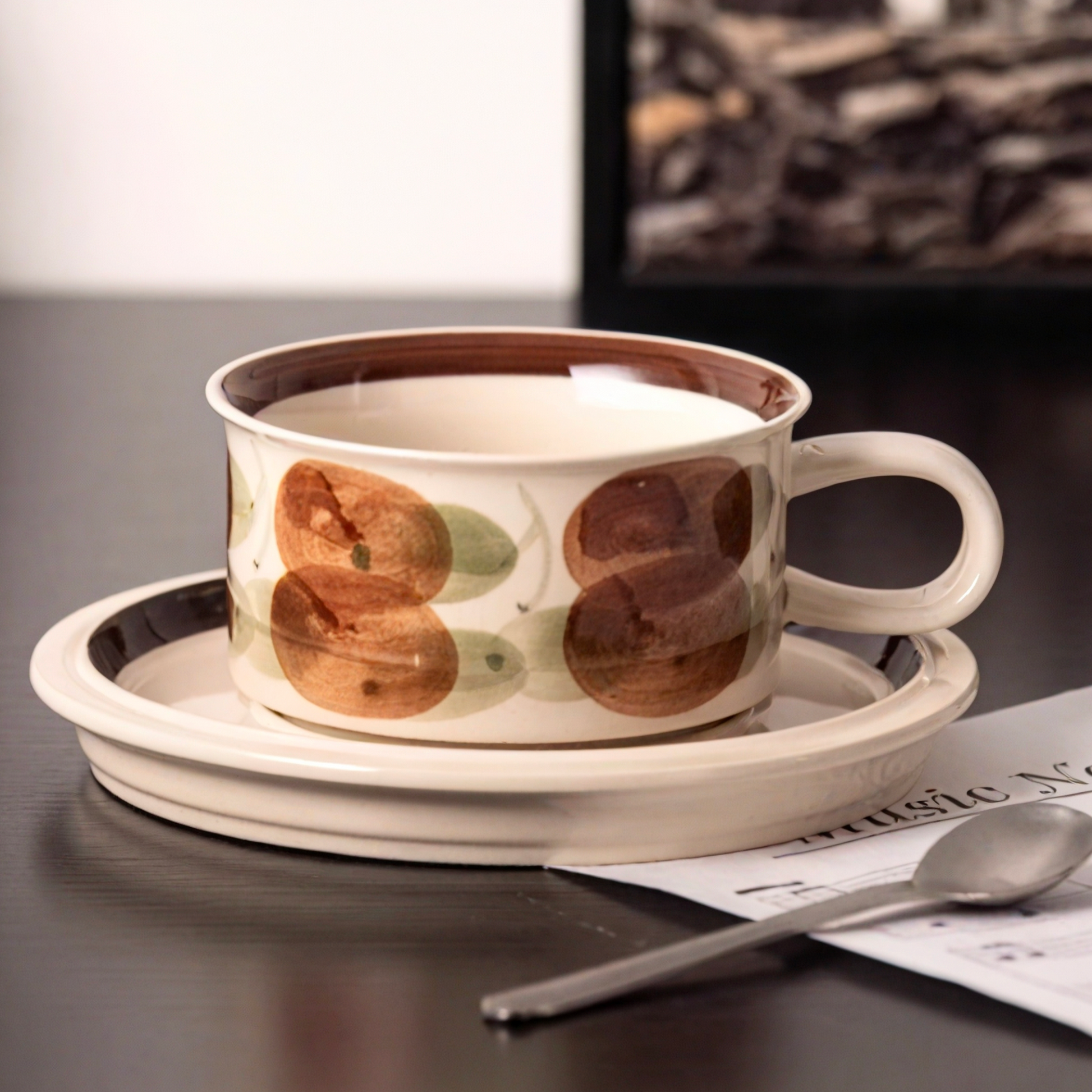 A ceramic coffee cup with bold artistic brushstrokes, adding Scandinavian charm to your tableware collection.