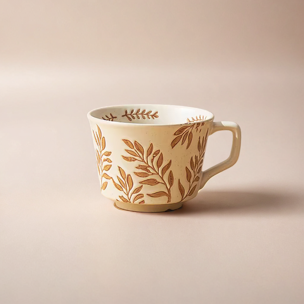 Hand-painted ceramic mug with artful botanic patterns, offering a Nordic-inspired design. Perfect for iced or hot drink.