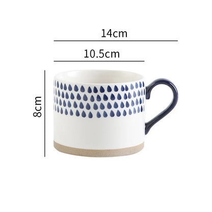 Hand-painted ceramic mug featuring a Nordic blue drop pattern, ideal for coffee and tea lovers.