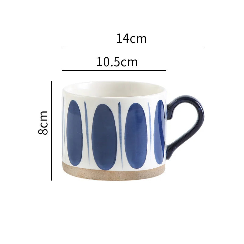 Hand-painted ceramic mug with abstract oval patterns, offering a Nordic-inspired design.