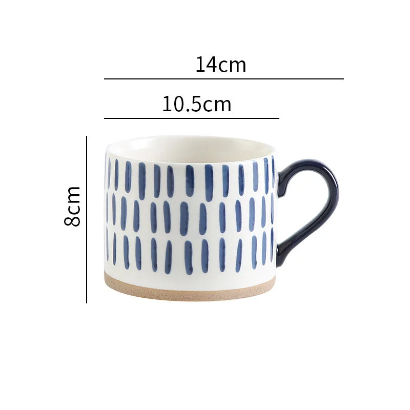 Elegant ceramic mug with hand-painted blue vertical lines, perfect for minimalist homes.