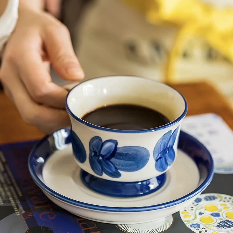 Blue flower ceramic cup set styled on a minimalist table, perfect for hot beverages like coffee, tea, and lattes.