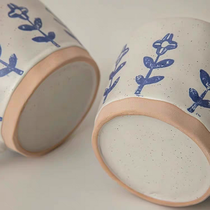 Detailed view of the bottom of the premium ceramic mug, emphasizing its handcrafted design and neutral color.