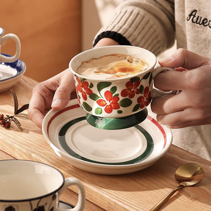 Hand-painted ceramic coffee cup filled with coffee, styled as mid-century modern home drinkware, microwave and oven safe.