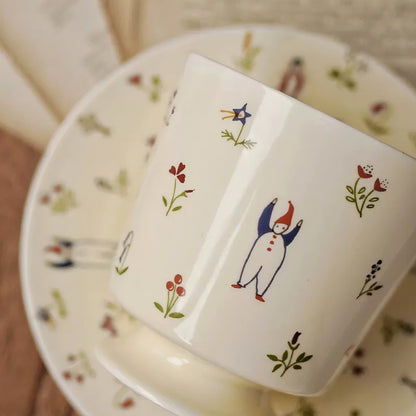 Aesthetic drinkware featuring hand-painted snowman in a botanical winter scene. Adorable, durable, artistic.