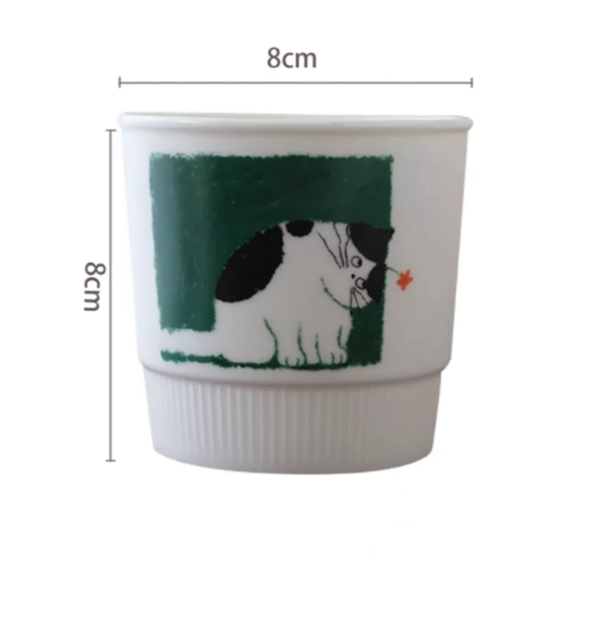 Artistic coffee mug featuring a dreamy kitten looking up in wonder, rendered in hand-painted underglaze style. This aesthetic ceramic cup holds 280ml and is perfect for warm drinks on calm, cozy days.