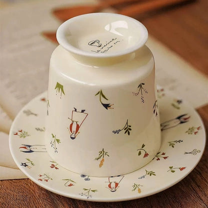 Handcrafted ceramic tea cup and saucer with secret garden and cute snowman design.  Unqiue and stylish for daily use or home decoration.