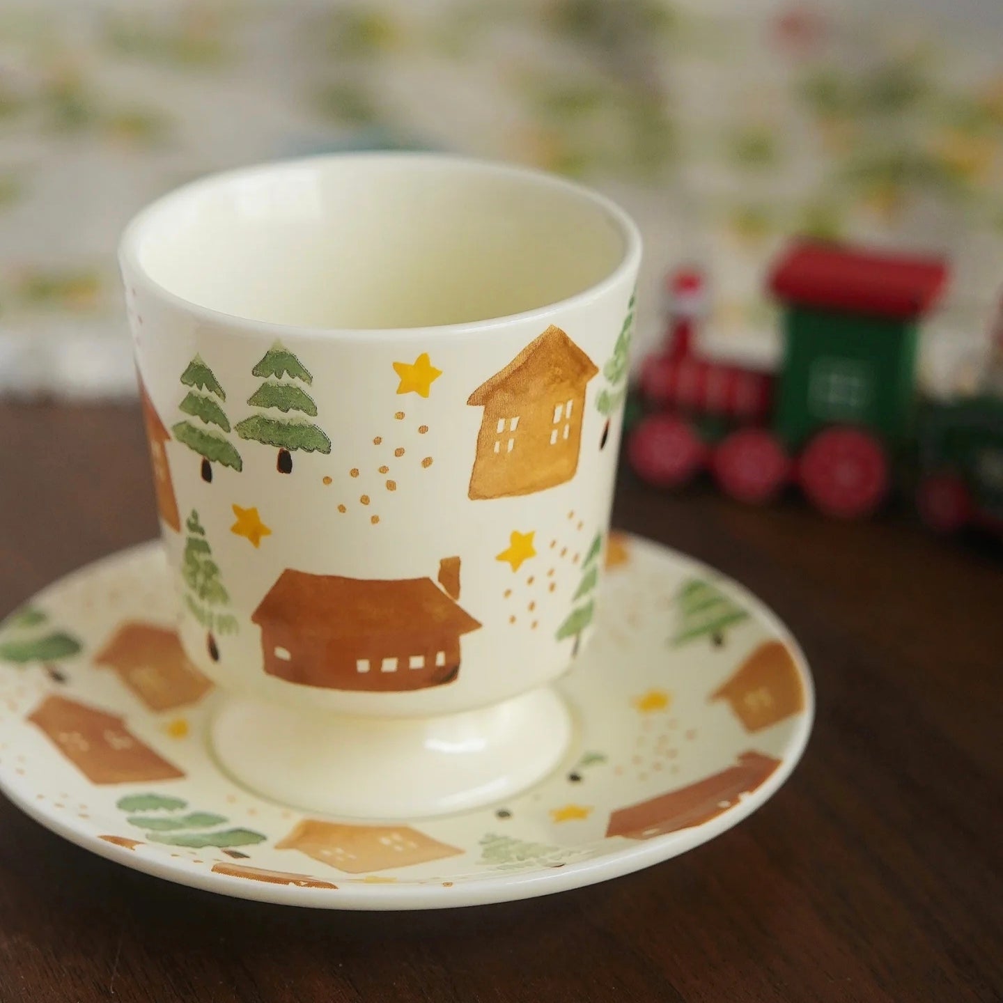 Cartoon-style house and fir tree illustration on durable underglaze ceramic coffee cup. Microwave and dishwasher save. Charming and lovely gift choice.