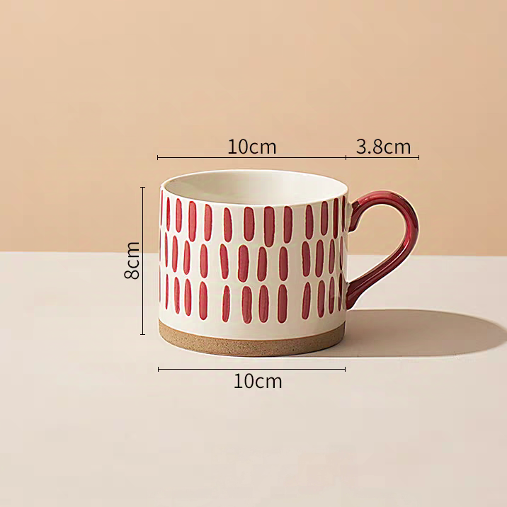Decorative ceramic mug featuring a red line pattern, perfect for enhancing table aesthetics. Microwave, dishwasher safe.