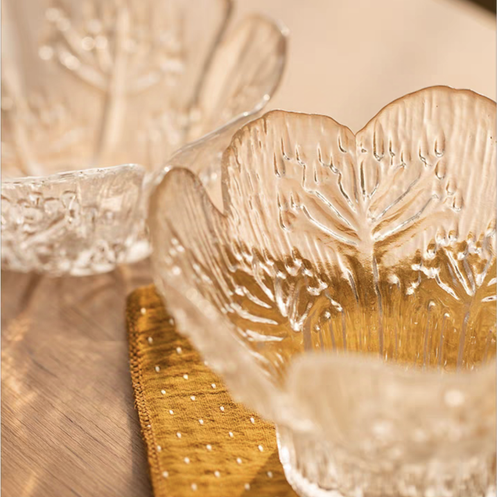 Close-up view of the floral embossed pattern on the 4.5-inch transparent glass dessert bowl, highlighting craftsmanship and style.