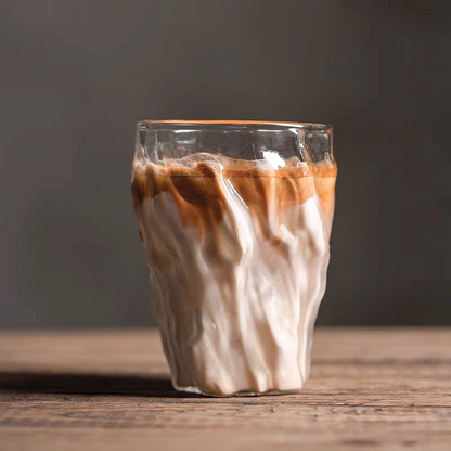 A layered dirty coffee served in a crystal-textured glass cup, highlighting its artisan twist design and 300ml capacity.