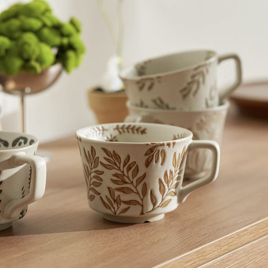 Japandi-inspired ceramic mugs with hand-painted botanic patterns, 350ml/ 11.8 oz capacity, perfect for coffee and tea lovers.