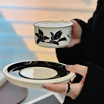 A ceramic coffee cup featuring nature-inspired patterns, blending Scandinavian style with rustic charm.