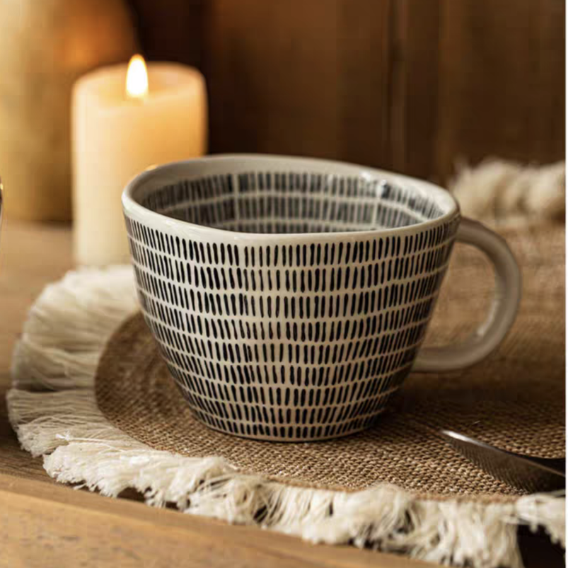 Hand crafted ceramic mugs featuring dotted patterns. Perfect for coffee, tea, or more.