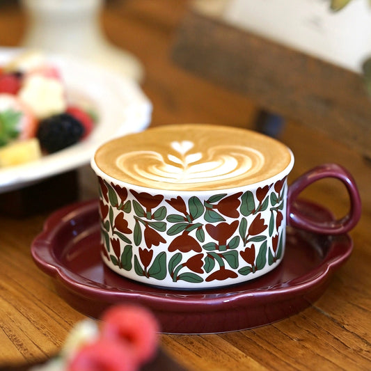Hand-painted ceramic tea or coffee cup featuring red tulips and greenery, perfect for cozy coffee moments. Craft from durable and high temperature resistant ceramic.