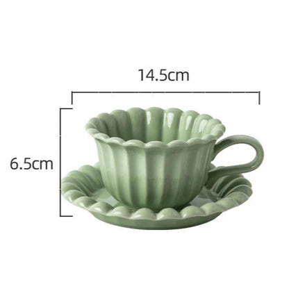 Scandinavian-style light green coffee cup and plate set with floral design, perfect for minimalist home decor.