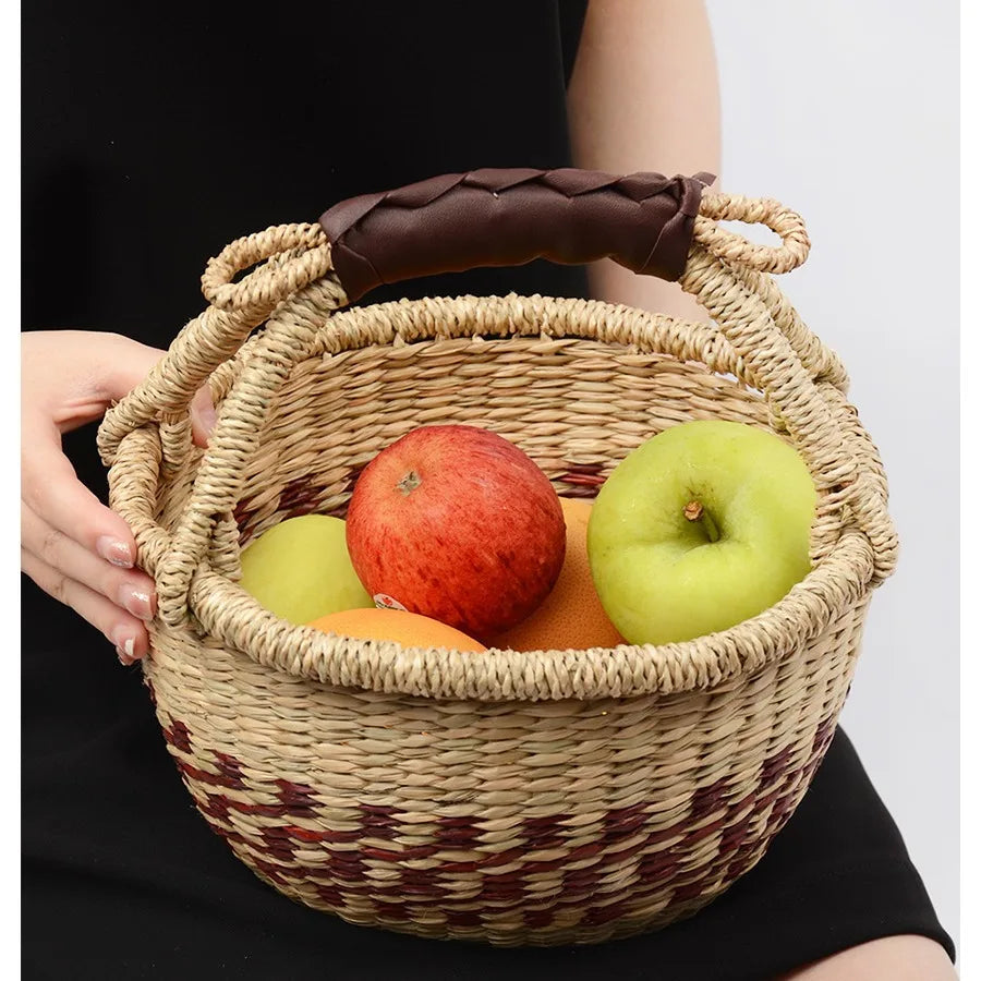 Eco-friendly seaweed basket filled with fruits, ideal for picnics and outdoor gatherings in cottage-inspired settings.