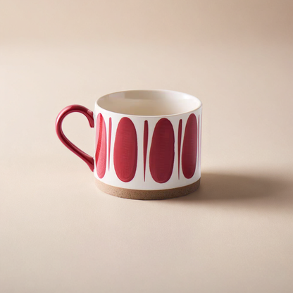 Red-patterned ceramic mug with a Scandinavian-inspired minimalist design, perfect for coffee or tea.