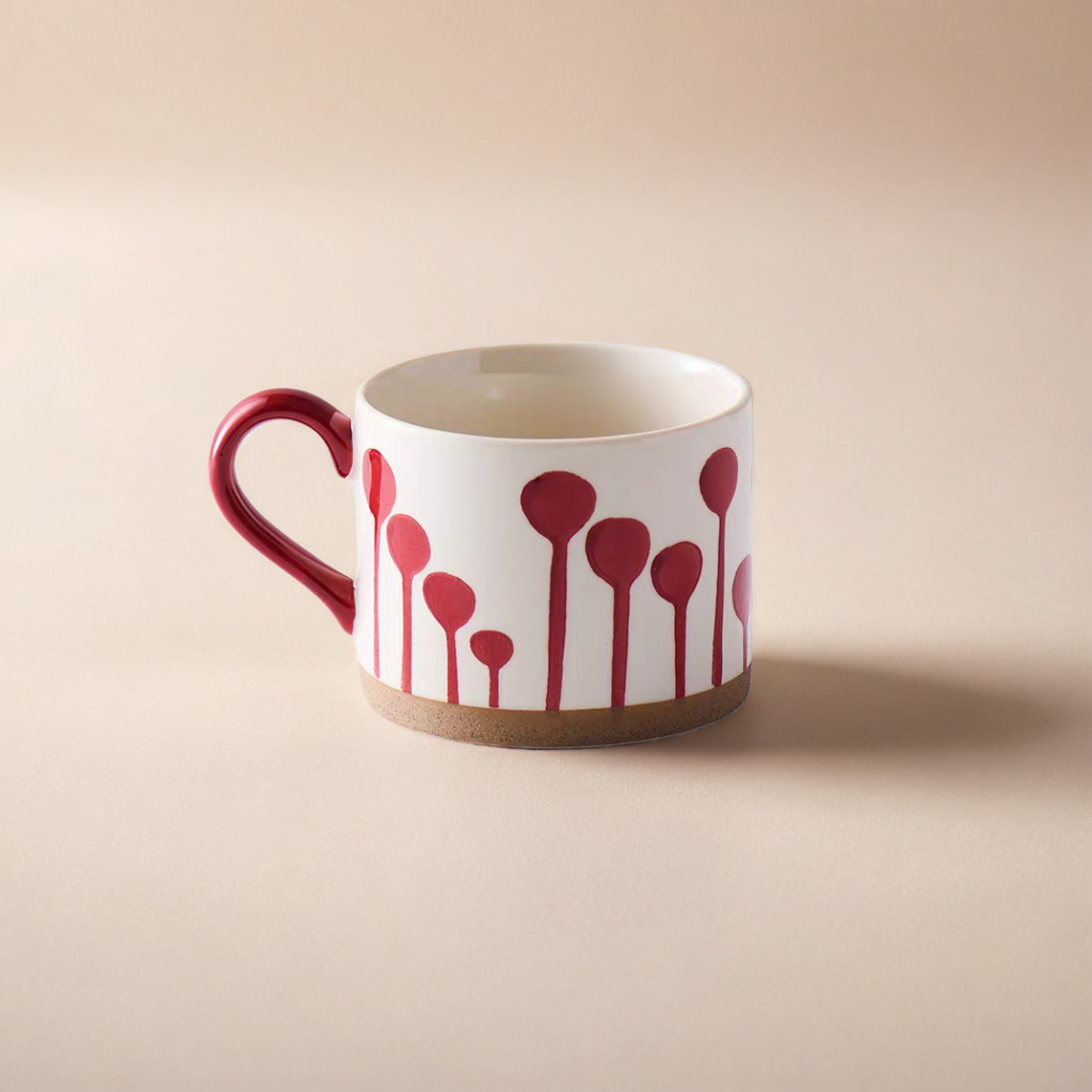 Red-patterned ceramic mug with a Scandinavian-inspired minimalist design, perfect for coffee or tea.