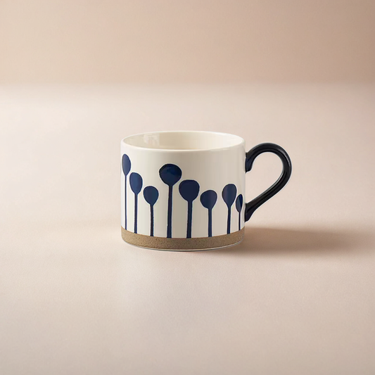 Hand-painted ceramic mug with abstract balloon patterns, offering a Nordic-inspired design.