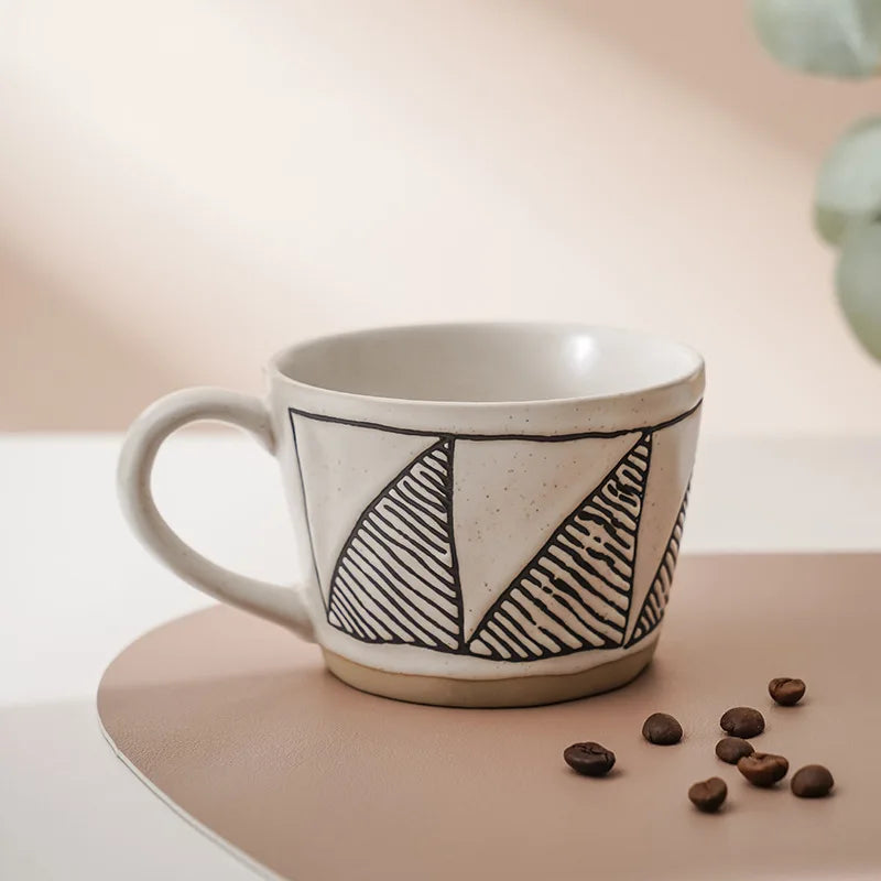 A beautifully crafted, neutral-colored ceramic cup, perfect for hot or iced beverages, with elegant Nordic patterns.