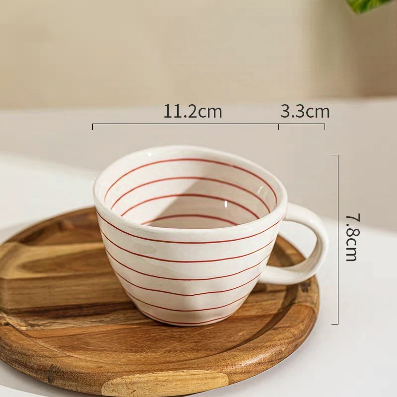 Durable ceramic mug for coffee, tea, and desserts. Featuring bold red stripes and a 350ml (11.8 oz) capacity.