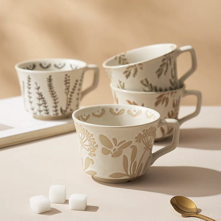 A collection of mugs with retro Scandinavia patterns and coarse pottery textures, highlighting their neutral tones and artisan craftsmanship.