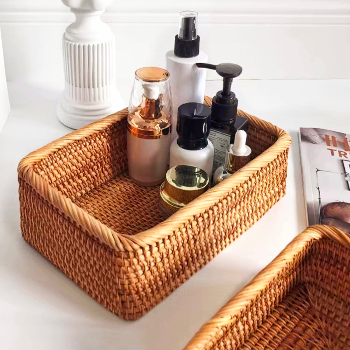 Rattan wicker storage box used for organizing cosmetics and skincare products on a vanity table