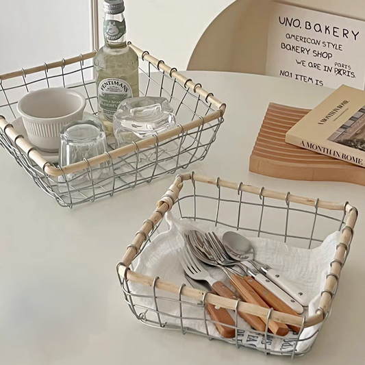 Square woven metal wire storage basket filled with tableware, showcasing its durable metal and natural rattan design in Scandinavian minimalism style. Two sizes available.