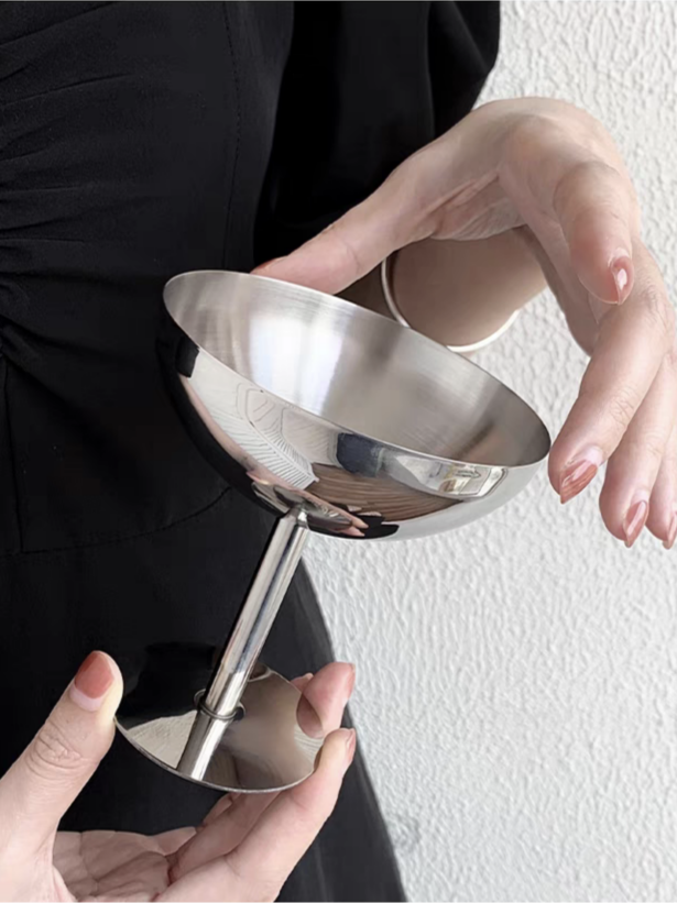 Elegant high-footed stainless steel goblet, featuring a contemporary and minimalist aesthetic. Use for serving ice-creams, fruits and desserts.