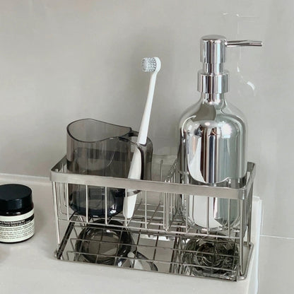 Contemporary stainless steel rack, designed to neatly store bathroom bottles, skincare products, and cleaning supplies on countertops.