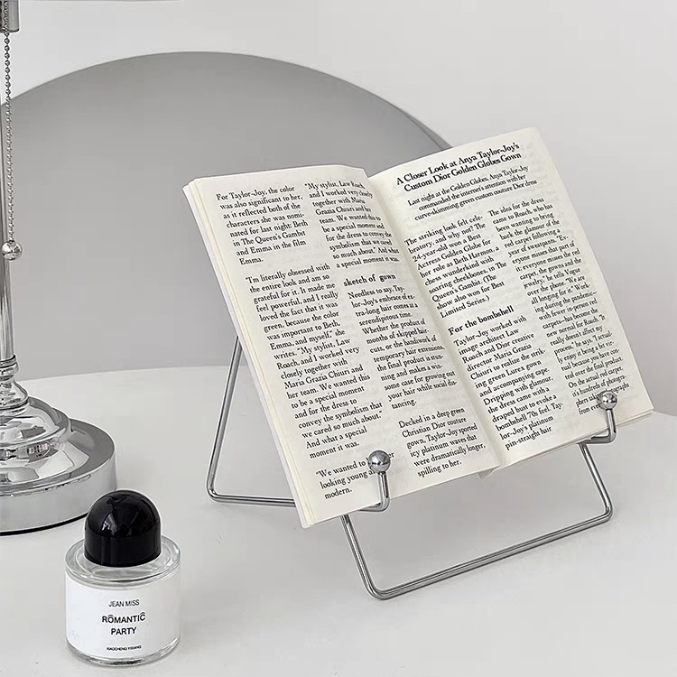 Versatile stainless steel desktop stand with a silver finish, perfect for holding books.