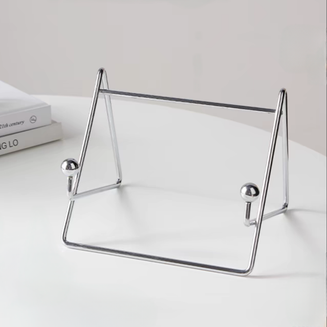 Sleek stainless steel desktop stand with a silver finish, for laptop, tablet, books.